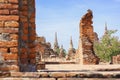 An ancient pagoda in an old temple and a very old brick wall in Ayutthaya, Thailand