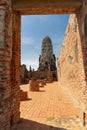 An ancient pagoda in an old temple and a very old brick wall in Ayutthaya, Thailand