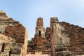 An ancient pagoda in an old temple and a very old brick wall in Ayutthaya, Thailand