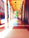 Ancient palace in Bologna city Italy with its golden arcade in Independence street Royalty Free Stock Photo