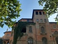 Ancient palace with falling plants to Rome in Italy.