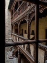 Ancient patio with wooden staircase in old timber-framing rich house XV century Royalty Free Stock Photo