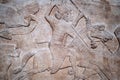 Ancient persian bas-relief depicting warriors on horseback Royalty Free Stock Photo