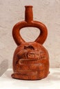 Ancient Peruvian ceramic vessel with a serpent, Cupisnique culture