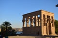 Ancient pharaohs Philae temple in Aswan Egypt in the river nile , old temple have hieroglyphs craved in its stones/Trajan`s Kiosk