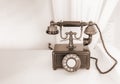 Ancient phone is placed on a wooden table Royalty Free Stock Photo