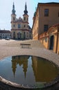 Ancient Piarist Church of the Discovery and its reflection in the water. Baroque church and monastery from 1714 Royalty Free Stock Photo