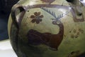 Ancient pottery with animals and hunting scenes
