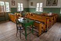 Ancient primary school classroom with antique desks in Rumsiskes Etnographic museum Lithuania Royalty Free Stock Photo