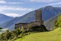 The ancient Prince`s Castle of Burgusio, South Tyrol, Italy, with the snow capped Alps in the background Royalty Free Stock Photo