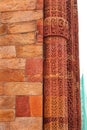 Ancient red sandstone minaret old architecture Columns with stone carving in courtyard Royalty Free Stock Photo