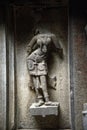 Ancient relief carving of woman on the wall of temple