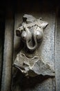 Ancient relief carving of woman on the wall of temple