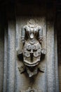 Ancient relief carving of woman on the wall of temple