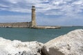 The ancient Rethymnon Lighthouse in the harbor of the city of Rethimno, Crete, Greece Royalty Free Stock Photo