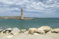 The ancient Rethymnon Lighthouse in the harbor of Rethimno city, Crete, Greece Royalty Free Stock Photo