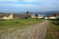 Ancient road paved with cobblestone and going to medieval fortress. Royalty Free Stock Photo