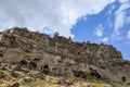 Ancient rock-cut cave houses and christian temples cut in pink tufa stone, Ihlara Valley, Cappadocia