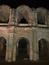 Ancient Roman amphitheatre, UNESCO World Heritage Site, in the historic center of town Arles, Provence, France in at night. Royalty Free Stock Photo