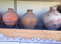 Ancient Roman Amphorae stacked up against a wall. These were used for carrying wine. Royalty Free Stock Photo