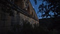 Ancient Roman aqueduct Pont du Gard constructed of big stone blocks in the dark near Vers-Pont-du-Gard, Occitanie, France. Royalty Free Stock Photo