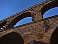 Ancient Roman aqueduct Pont du Gard with stone arches after sunset near Vers-Pont-du-Gard, Occitanie, France with clear sky. Royalty Free Stock Photo