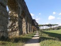 Ancient Roman aqueduct to Rome in Italy. Royalty Free Stock Photo