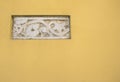 Ancient Roman Bas-relief art in a yellow wall