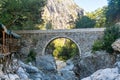 Ancient Roman bridge over a mountain river in the Kesme Bogazi canyon, Turkey Royalty Free Stock Photo
