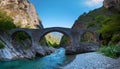Roman bridge over a mountain stream, AI generated Royalty Free Stock Photo