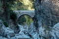 Ancient Roman bridge over a shady gorge in the Kesme Bogazi canyon, Turkey Royalty Free Stock Photo