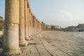 Columns of the cardo maximus, Arch of Hadrian, Temple of Artemis - Jerash, Jordan. oval forum Royalty Free Stock Photo