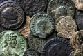 Ancient Roman coins with emperors portraits close-up, pile of old metal money, top view of vintage pattern background. Concept of Royalty Free Stock Photo