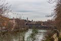 Ancient Roman embankment and stone bridge over the Tiber River, Rome, Italy Royalty Free Stock Photo