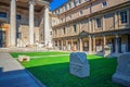 Ancient Roman Empire ruins on green lawn of courtyard of Museo Lapidario Royalty Free Stock Photo