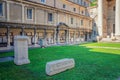 Ancient Roman Empire ruins on green lawn of courtyard of Museo Lapidario Royalty Free Stock Photo