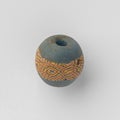 Ancient Roman glass bead with an ornamental band