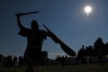 An ancient Roman legionary fights with sword, helmet and shield Royalty Free Stock Photo