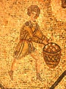 Ancient roman mosaic of a man in a tunic