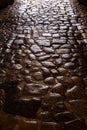 Ancient roman pavement with smooth stones, background and texture Royalty Free Stock Photo