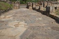 Ancient Roman road in the Roman ruins of Baelo Claudia, located near Tarifa, Andalusia, Spain Royalty Free Stock Photo