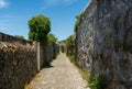 The ancient Roman road with stone walls both sides in Portugal