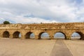 Ancient Roman ruins of aqueduct in Ceasarea Israel historical monument.