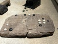 Ancient Roman stone made checkers game with dice at the British Museum in London Royalty Free Stock Photo