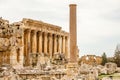 Ancient Roman temple of Bacchus and column in the foreground with surrounding ruins of ancient city, Bekaa Valley, Baalbek,