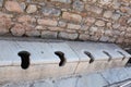 Ancient Roman Toilet WC A room lined with stone toilets, Efes, Turkey