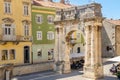 Ancient Roman triumphal arch or Golden Gate and square in Pula, Croatia, Europe