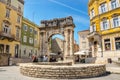 Ancient Roman triumphal arch or Golden Gate and square in Pula, Croatia, Europe