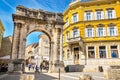 Ancient Roman triumphal arch or Golden Gate and square in Pula, Croatia, Europe Royalty Free Stock Photo