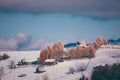 Ancient romanian houses on the frozen hills in the middle of winter